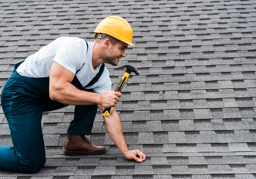 worker using a hammer